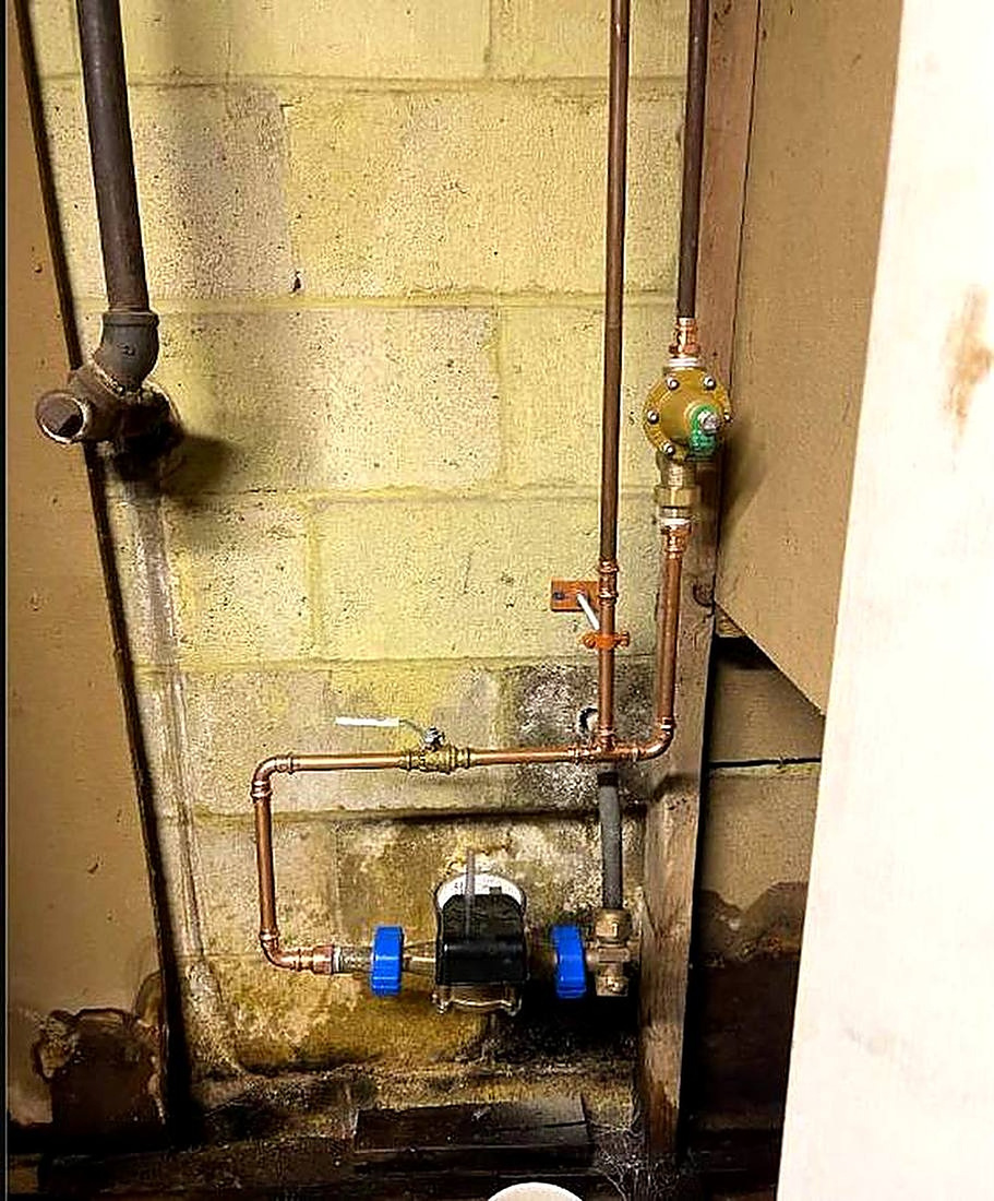 New copper water line and pressure regulator on an older Rochester house
